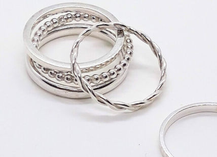An image of hand made silver rings