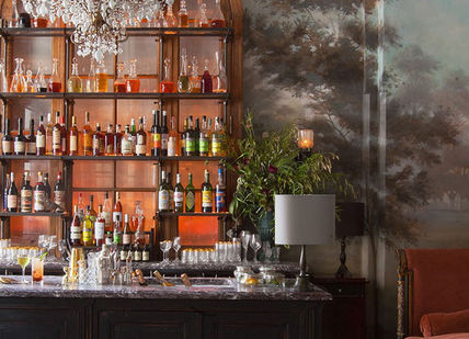 An image of a bar with a large wall mural, Private Masterclass With Chef Daniel Rose. Conundrum