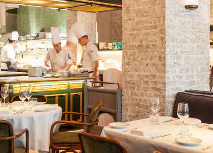 An image of a restaurant setting with people, Private Masterclass With Chef Daniel Rose. Conundrum