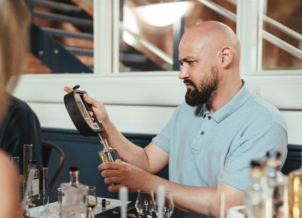 An image of person creating a whisky