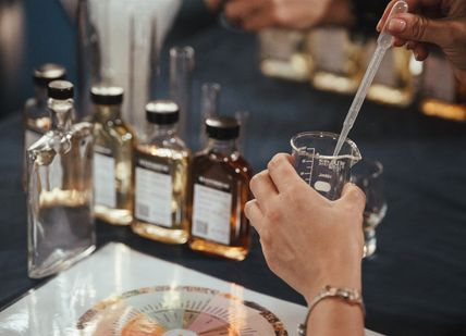 An image of person making whisky