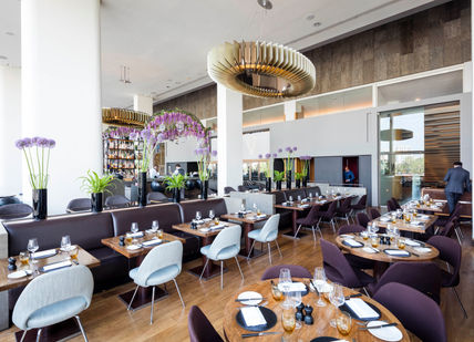 An image of a restaurant setting with tables and chairs, Gin & Tonic Masterclass With Three-Course Lunch. D&D - Skylon