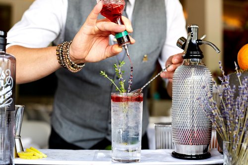 A man making a cocktail.