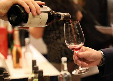 An image of a person pouring wine into a glass, Davy’s Wine Tasting Class . Davy's Wine Bar