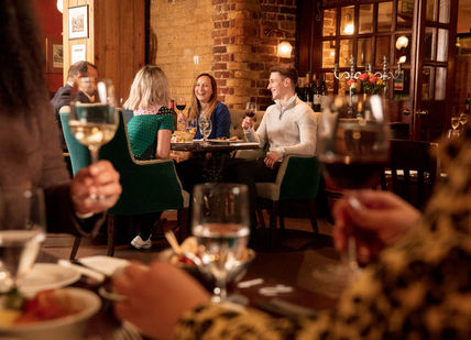 An image of people having a wing tasting in the venue