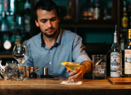 An image of a man at a bar, Gin Masterclass. The Distillery