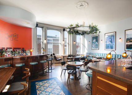 An image of a restaurant with a bar, The Whisky Thing Experience. The Distillery