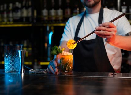 An image of person making a cocktail
