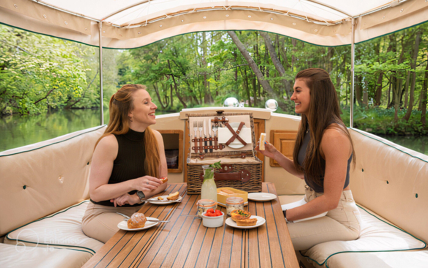 Two women sitting on a boat.