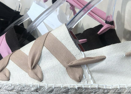 An image of a wall with many different colored ribbons, Classic Espadrilles Online Workshop. Handmade Barcelona