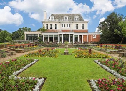 An image of a garden with flowers and a house in the background, Two nights and dinner. Hotel du Vin Wimbledon