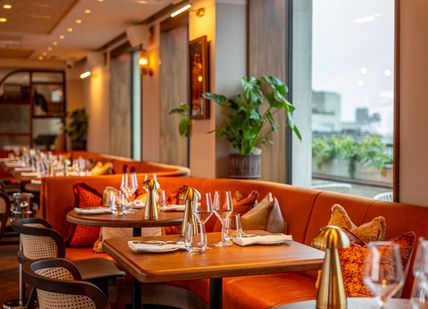 An image of tables near the windows