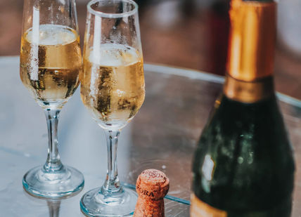An image of two glasses of champagne and a bottle of champagne, Two-Hour Prosecco Tasting. Loki