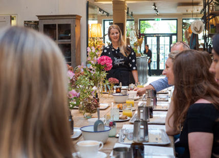 People sitting around the table and having a candle making class.London Refinery 