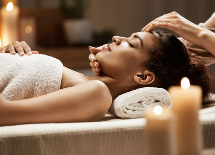 An image of a woman getting a massage, Day spa delight. Luenire