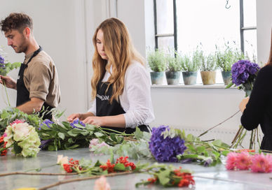 An image of a woman making flowers, One-Day Flower Masterclass. McQueens