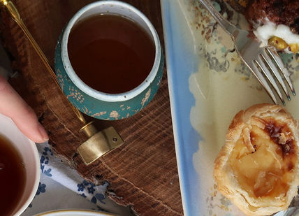 An image of a person eating food, At Home Tea Tasting. Miss TeaSmith