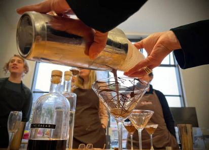 An image of a person pouring a drink, Luxury Chocolate Making Workshop. Mychocolate