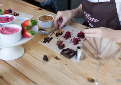 An image of a woman making a dessert, The Original Chocolate Making Workshop. Mychocolate