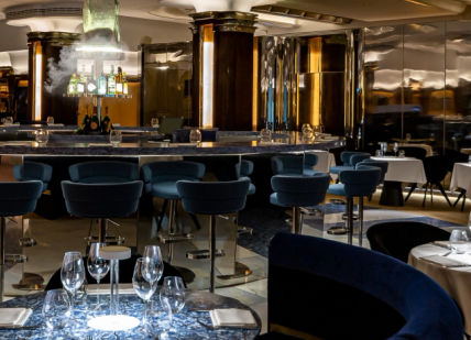 An image of a restaurant with blue chairs and tables, 3-course meal. Park Row