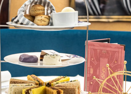 An image of a table with a plate of food and drinks, Afternoon tea. Park Row