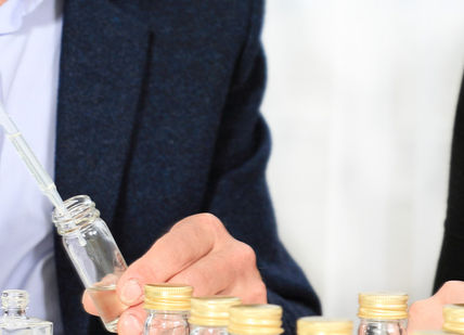 An image of a man and woman at a table, A Day With a Perfumer. The Perfume Studio