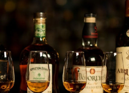 An image of a bunch of wine bottles, At home Rum Tasting. The Perseverance Marylebone