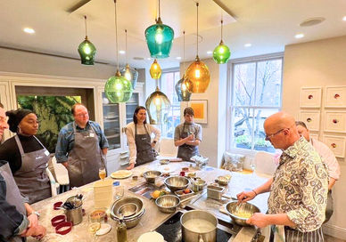 An image of chefs with table