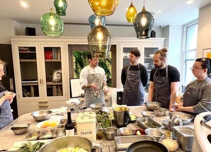 An image of chefs with table