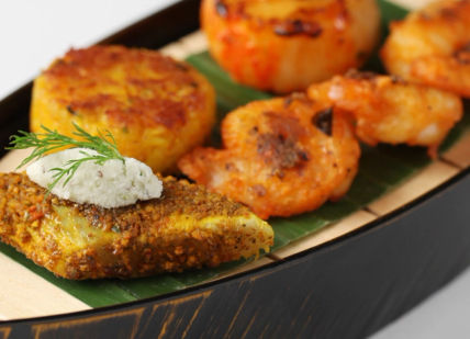 An image of a boat with food on it, Six-course tasting menu. Quilon