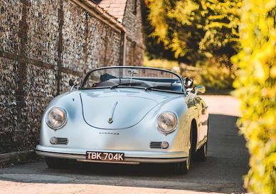 An image of a car parked in a driveway, Speedster.  RNG Classics