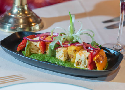 An image of a plate of food on a table, Three-Course Menu. The Rubens at the Palace - The Curry Room