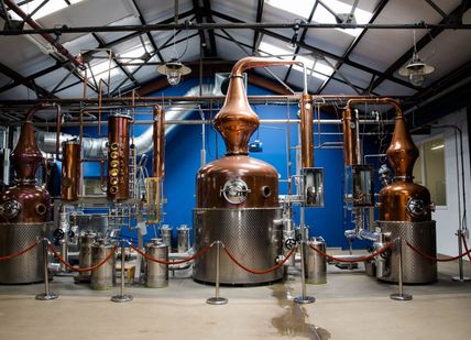 An image of a brewery with copper and copper, Gin masterclass. Sipsmith Distillery