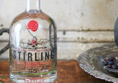 An image of a bottle of vodka with a red rose on it, Old Smiddy Gin School Masterclass. Stirling Distillery