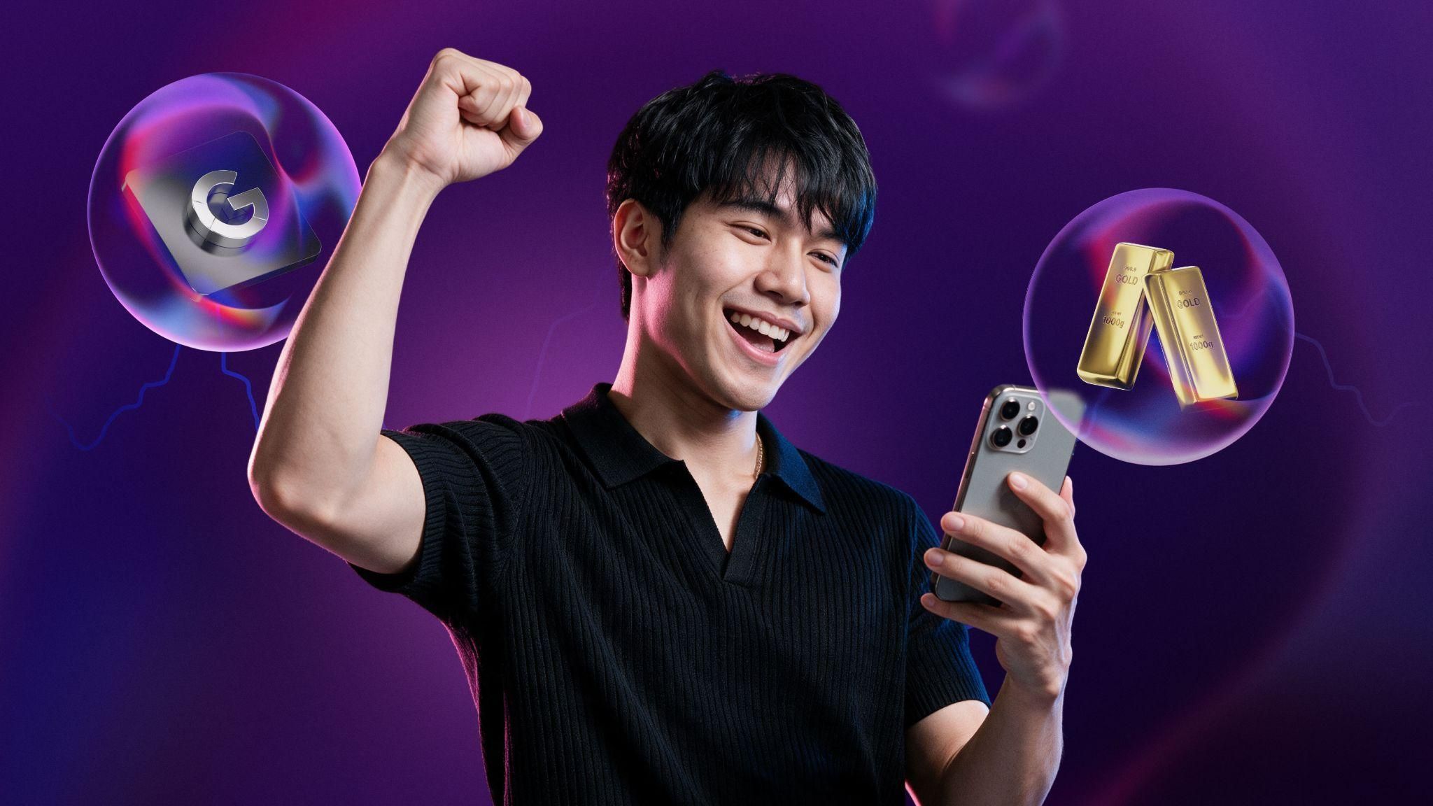 Man celebrating with phone next to glass bubbles containing a Google logo and gold bars