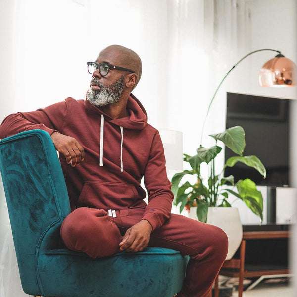 A man sitting on a chair inside