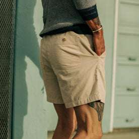 model posing with his hand in the pocket of The Après Short in Natural Pinwale