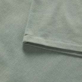 material shot of the sleeve on The Heavy Bag Ringer Tee in Slate and Seed