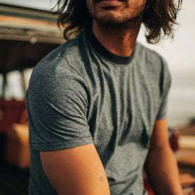 fit model showing off the top of The Cotton Hemp Tee in Slate and Navy Stripe