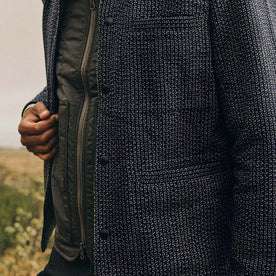 fit model wearing The Decker Jacket in Navy Wool Beach Cloth, hand holding jacket, up close shot