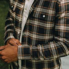 fit model showing the sleeve hems on The Ledge Shirt in Admiral Plaid