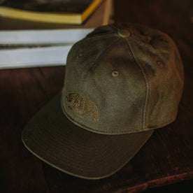 material shot of The Ball Cap in Stone Boss Duck on a table