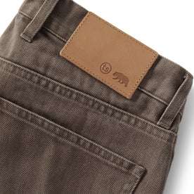 material shot of the leather patch on The Democratic All Day Pant in Washed Walnut Selvage