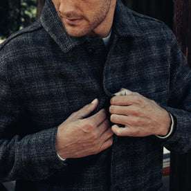 fit model buttoning The Ojai Jacket in Ash Plaid Wool