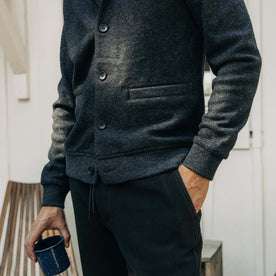 fit model showing hem and pockets on The Weekend Cardigan in Navy Herringbone Wool