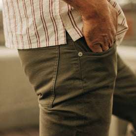 fit model wearing The Slim All Day Pant in Olive Bedford Cord, right hand in pocket