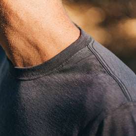 our fit model wearing The Standard Issue Tee in Navy Hemp—cropped shot of shoulder and collar