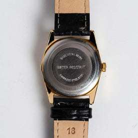 flatlay of the 1978 Timex Gold Marlin, shown from the back