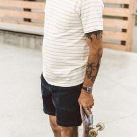 Our fit model skateboarding in The Heavy Bag Tee in Natural Stripe
