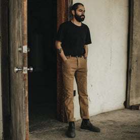 Our fit model wearing The Camp Pant in British Khaki Tuff Duck from Taylor Stitch.